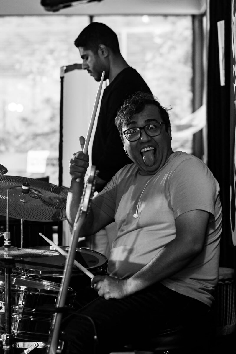 Rajarshi Banerjee mid-performance behind the drum kit